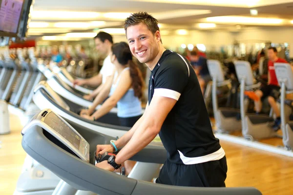 Man on treadmill smiling — Stock Photo, Image