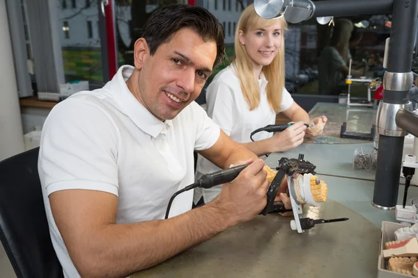 Dental technician with articulator — Stock Photo, Image