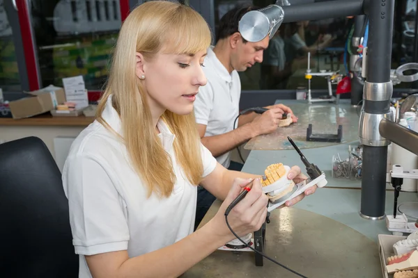 Dental technician working at articulator — Stock Photo, Image