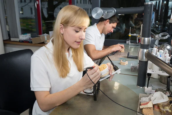 Dental technician working at articulator — Stock Photo, Image