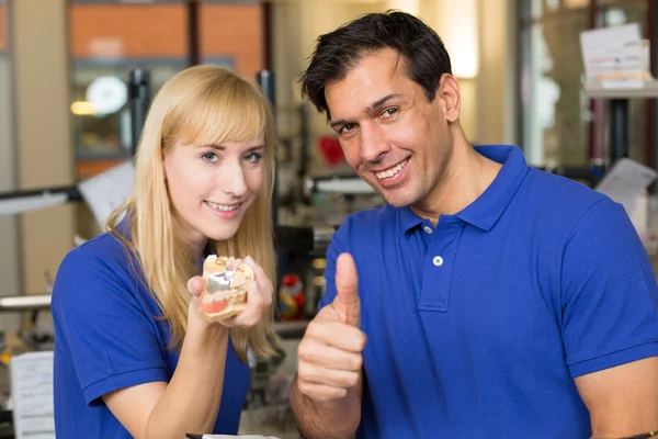 Dental technicians showing thumbs — Stock Photo, Image