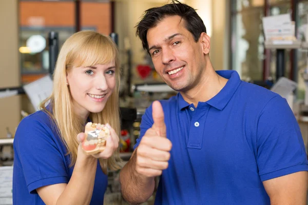 Dental technicians showing thumbs — Stock Photo, Image