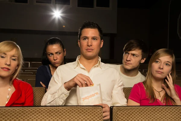 Tall man blocking the sight in the cinema — Stock Photo, Image