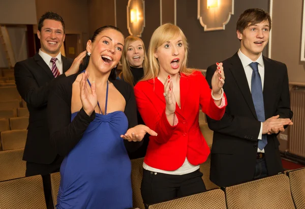 Theatre audience clapping and cheering — Stock Photo, Image