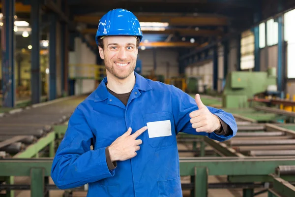 Construction worker in assembly hall — Stock Photo, Image