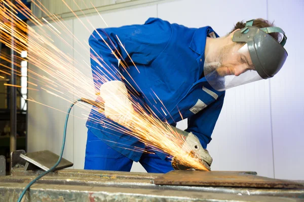 Construction worker with angle grinder — Stock Photo, Image