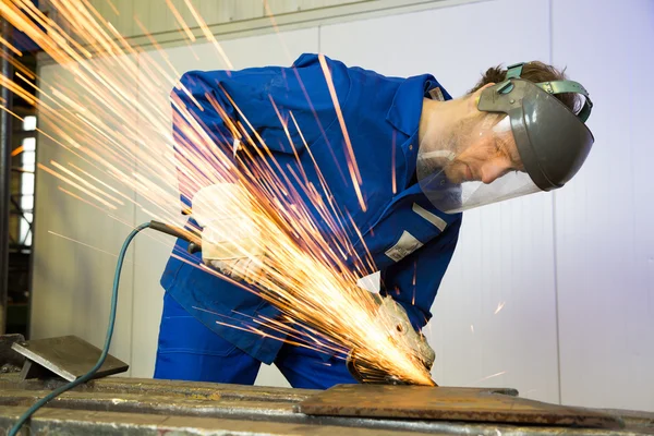 Construction worker with angle grinder — Stock Photo, Image