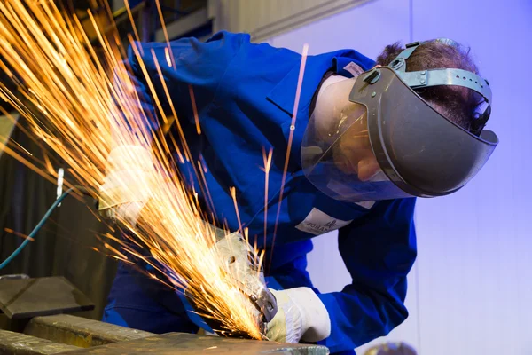 Construction worker with angle grinder — Stock Photo, Image