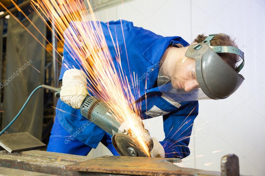 Construction worker with angle grinder