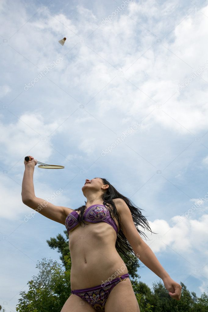 Girl plays Badminton in a park