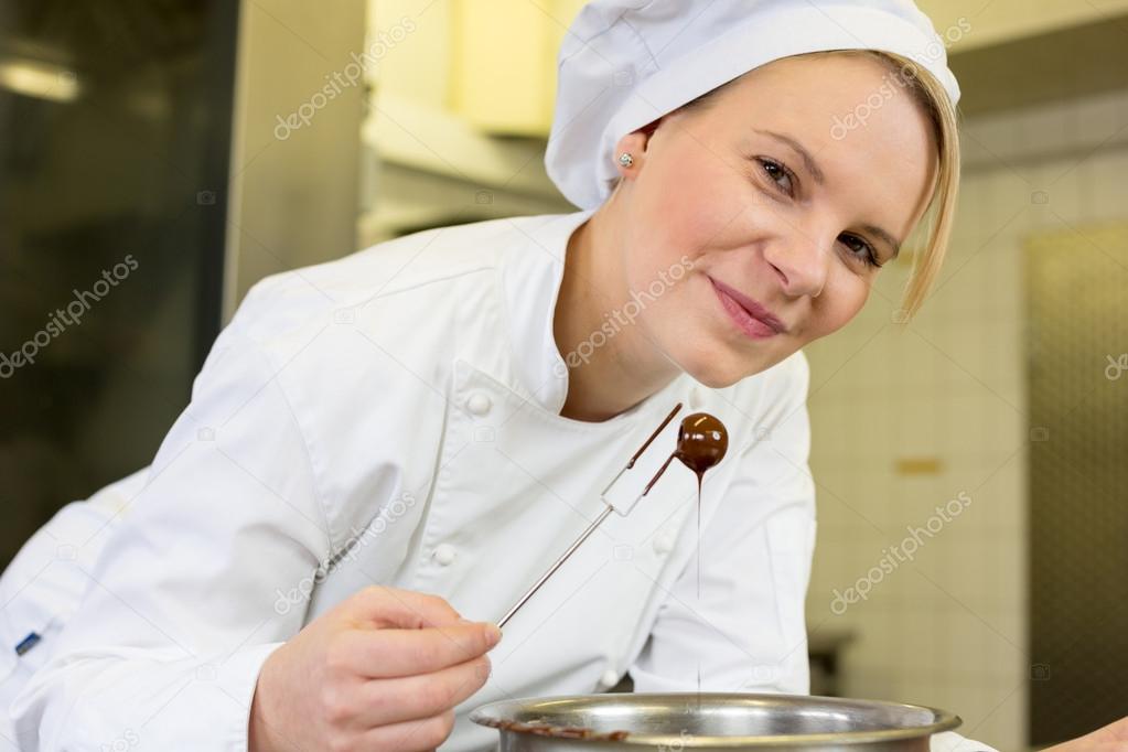 confectioner producing filled chocolates