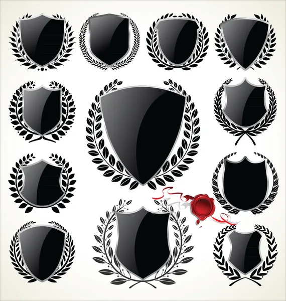 Black shield and laurel wreath collection — Stock Vector