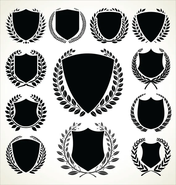 Colección de coronas de laurel y escudo negro — Vector de stock
