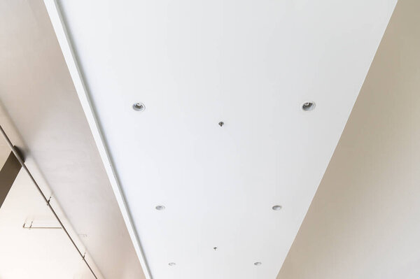Fluorescent lamps on the modern ceiling. Interior idea concept.