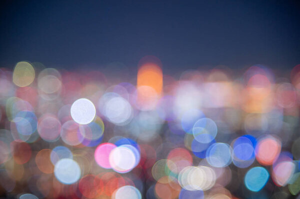 Night blurred bokeh light Japan city office building, abstract backgroun