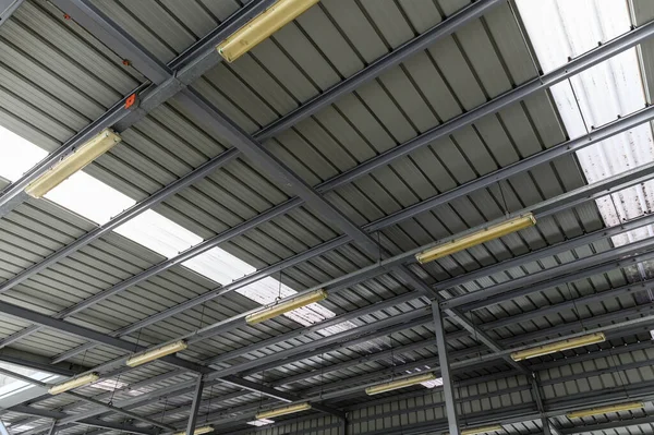 Fluorescent lamps on the modern ceiling. Luminous ceiling of square tiles. Interior idea concept.