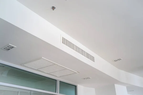 White ceiling mounted cassette type air conditioner for large rooms, exhibition room, for business use