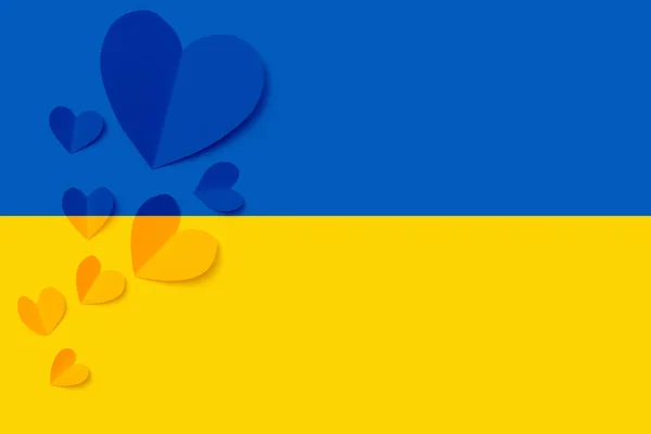 Stop war in Ukraine concept with heart and Ukrainian flag background.
