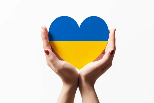 Women Hands Holding Ukraine Flag Color Heart Shape Paper White — Stok fotoğraf