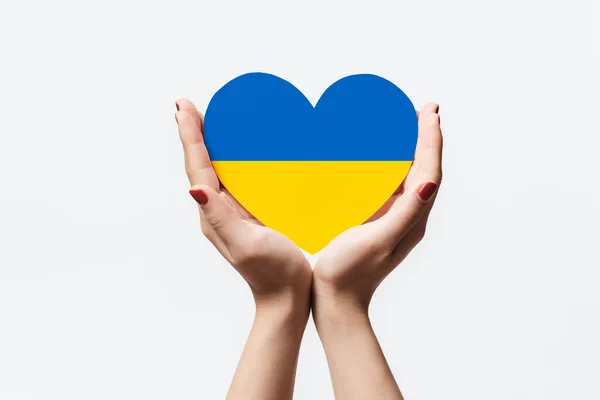 Women Hands Holding Ukraine Flag Color Heart Shape Paper White — Stok fotoğraf