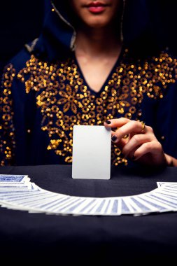 Fortune teller's hands and tarot cards. free copy space on card.