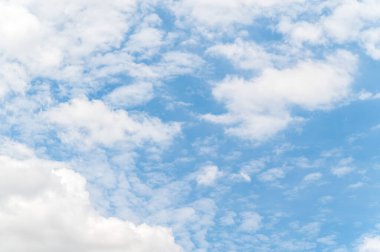 Beautiful white fluffy clouds in blue sky. Nature background from white clouds in sunny day.