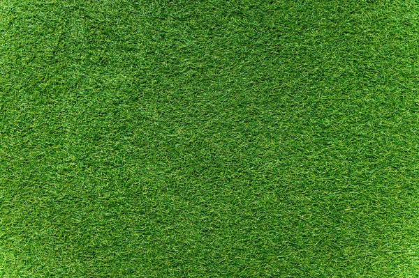 Yeşil yapay çim döşeme dokusu ve arka plan pürüzsüz.