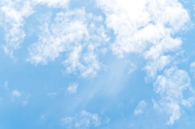 Beautiful white fluffy clouds in blue sky. Nature background from white clouds in sunny day.
