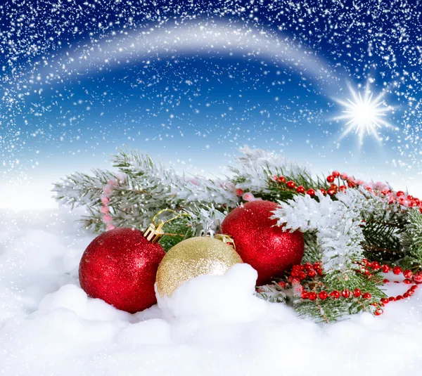 Christmas card with balls and star in the sky — Stock Photo, Image