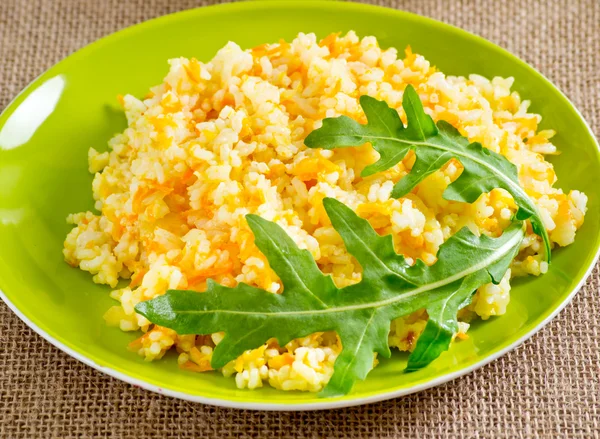 Rice and rucola leaves — Stock Photo, Image