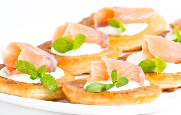 Sliced salted salmon served with pancake — Stock Photo, Image
