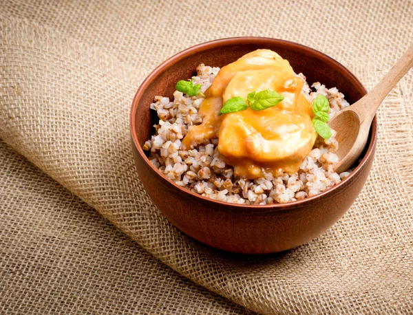 Buckwheat with meat and sauce — Stock Photo, Image