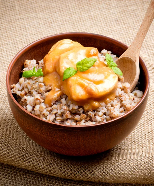 Buckwheat with meat and sauce — Stock Photo, Image