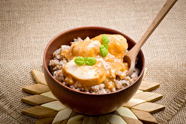 Buckwheat with meat and sauce — Stock Photo, Image