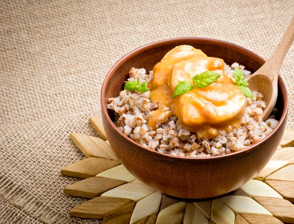 Buckwheat with meat and sauce — Stock Photo, Image