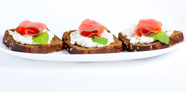 Sliced salted salmon served with rye bread — Stock Photo, Image