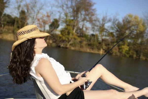 Mature Woman Fishing on a Boat — Stock Photo, Image