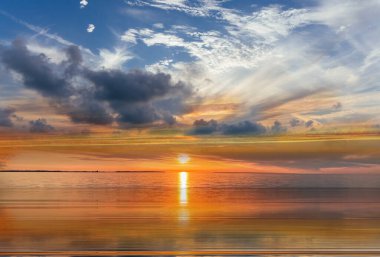 blue bright starry sky on pink yellow sunset at sea water vawe reflection blurred light full moon moonlight  skyline  nebula nature background 