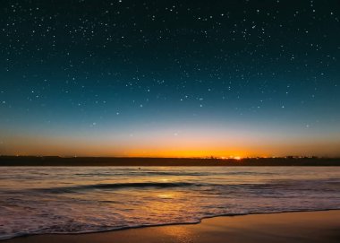 star on sky blue night  starry sky on pink yellow sunset at sea water vawe reflection blurred light full moon moonlight  skyline  nebula nature background 