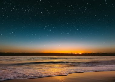 star on sky blue night  starry sky on pink yellow sunset at sea water vawe reflection blurred light full moon moonlight  skyline  nebula nature background 