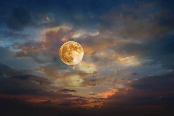 Big moon orange yellow dark light dramatic cloudy sky and nature background template