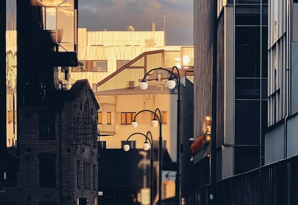 city at sunset  urban  street  industrial  building modern  and vintage architecture windows street lantern light at sunset  urban city life Tallin