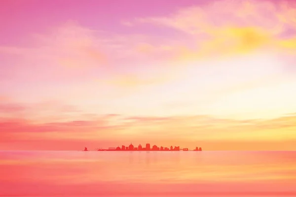 New York city on horizon at pink yellow pastel sky and clouds sunset and morning nature landscape pink pastel sky background