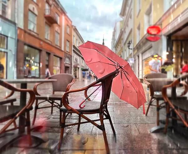 Pink Umbrella Chair Rainy City People Walk Umbrellas Wooden Table — Photo
