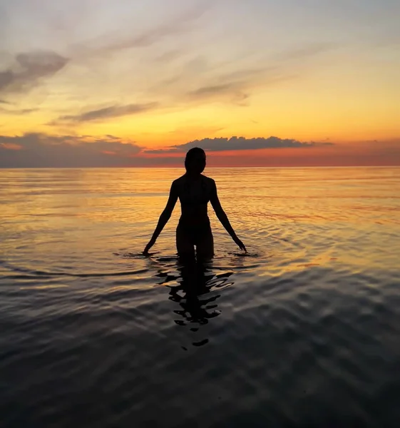 Relaxing Woman Orange Sunset Sea Girl Silhouette Sun Cloudy Evening — Stock Photo, Image