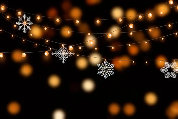 Kerst Bokeh Feestelijke Sneeuwvlokken Bokeh Lichte Slinger Defocus Donkere Achtergrond — Stockfoto