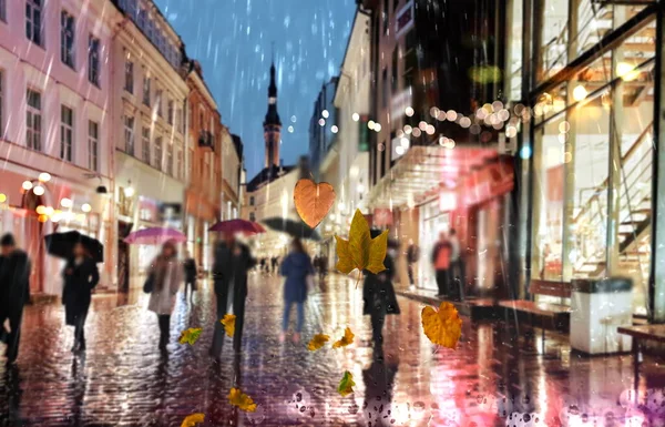 rain city  Autumn leaves  cold weather rainy drops on window and people silhouette with umbrellas night  traffic  light blurred reflection cold season view from window glass vitrines Tallinn Old Town