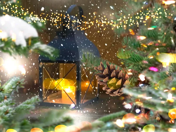 Christmas tree garland  illumination  with cone and street lantern  under snow flakes festive city street holiday scene ,winter  City