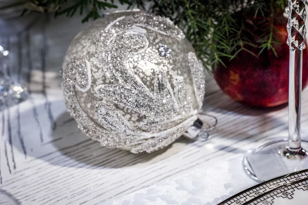 Silver christmas tree ball decoration on white table — Stock Photo, Image