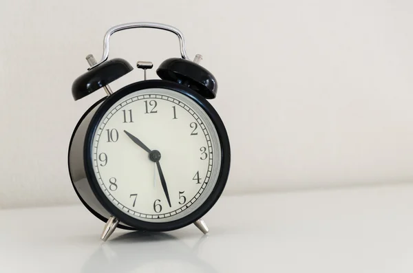 Alarm clock watch on vintage background — Stock Photo, Image